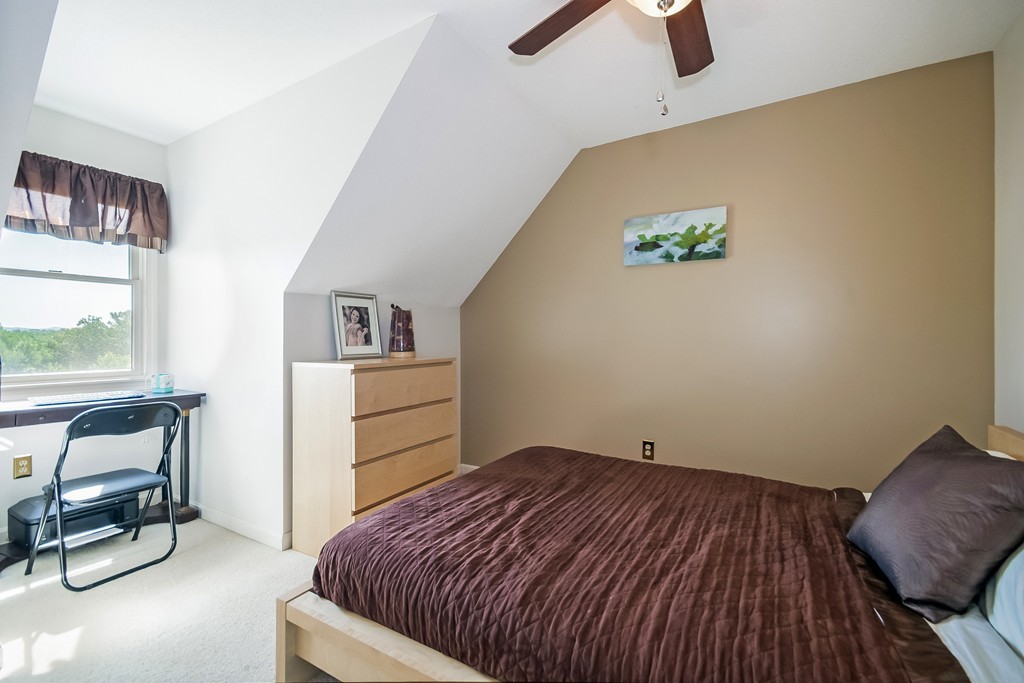 46 Gates Avenue Springfield, MA 01118 - Photo 18 of 26 a bedroom with a bed and a dresser