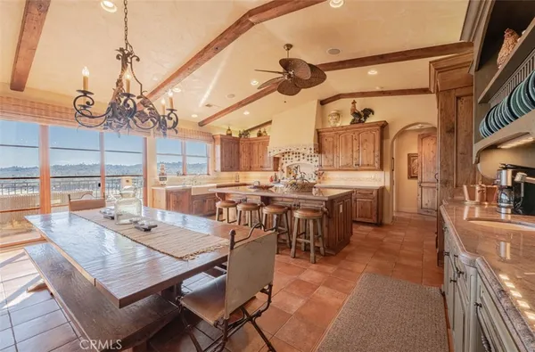 a kitchen with sink stove and cabinets