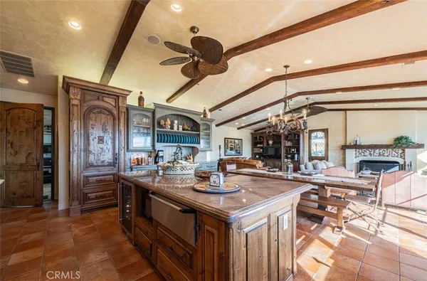 a kitchen with stainless steel appliances sink stove and cabinets