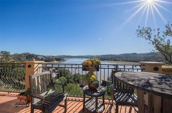 a view of a balcony with lake view and mountain view