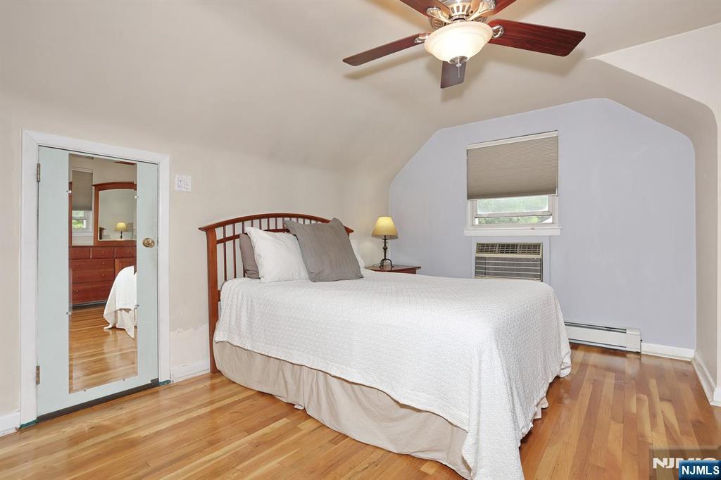 87 Barbara Road Dumont, NJ 07628 - Photo 29 of 48 a bedroom with a bed and window