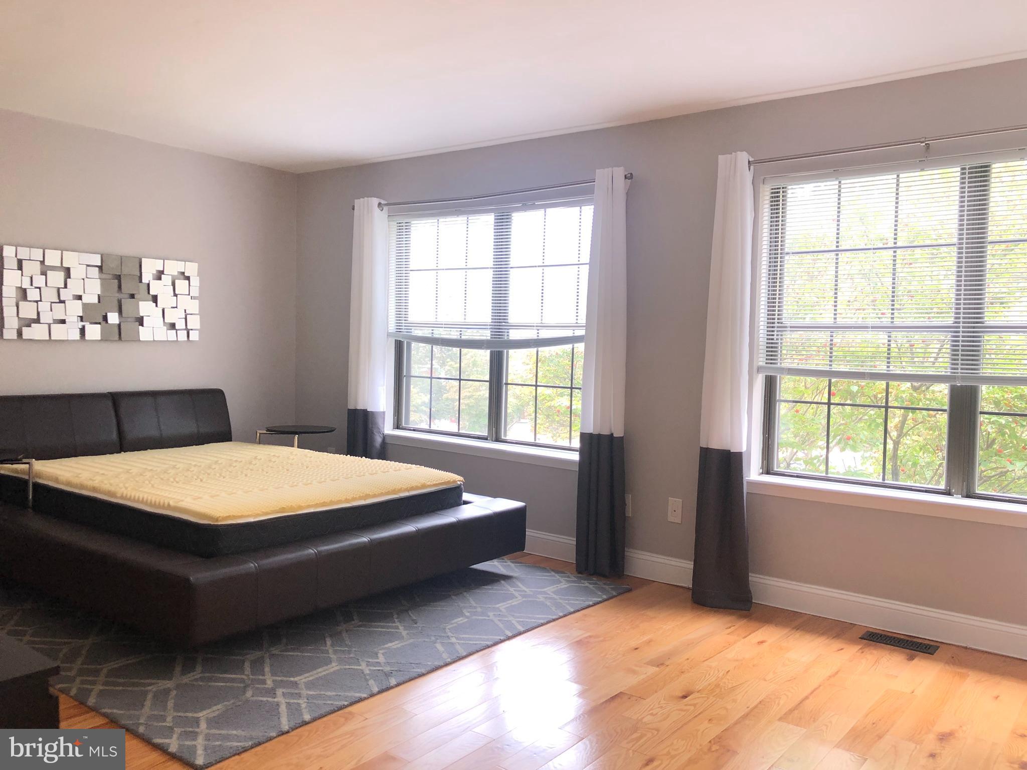 5 Algonquin Court Chesterbrook, PA 19087 - Photo 14 of 18 a bedroom with a bed and a window