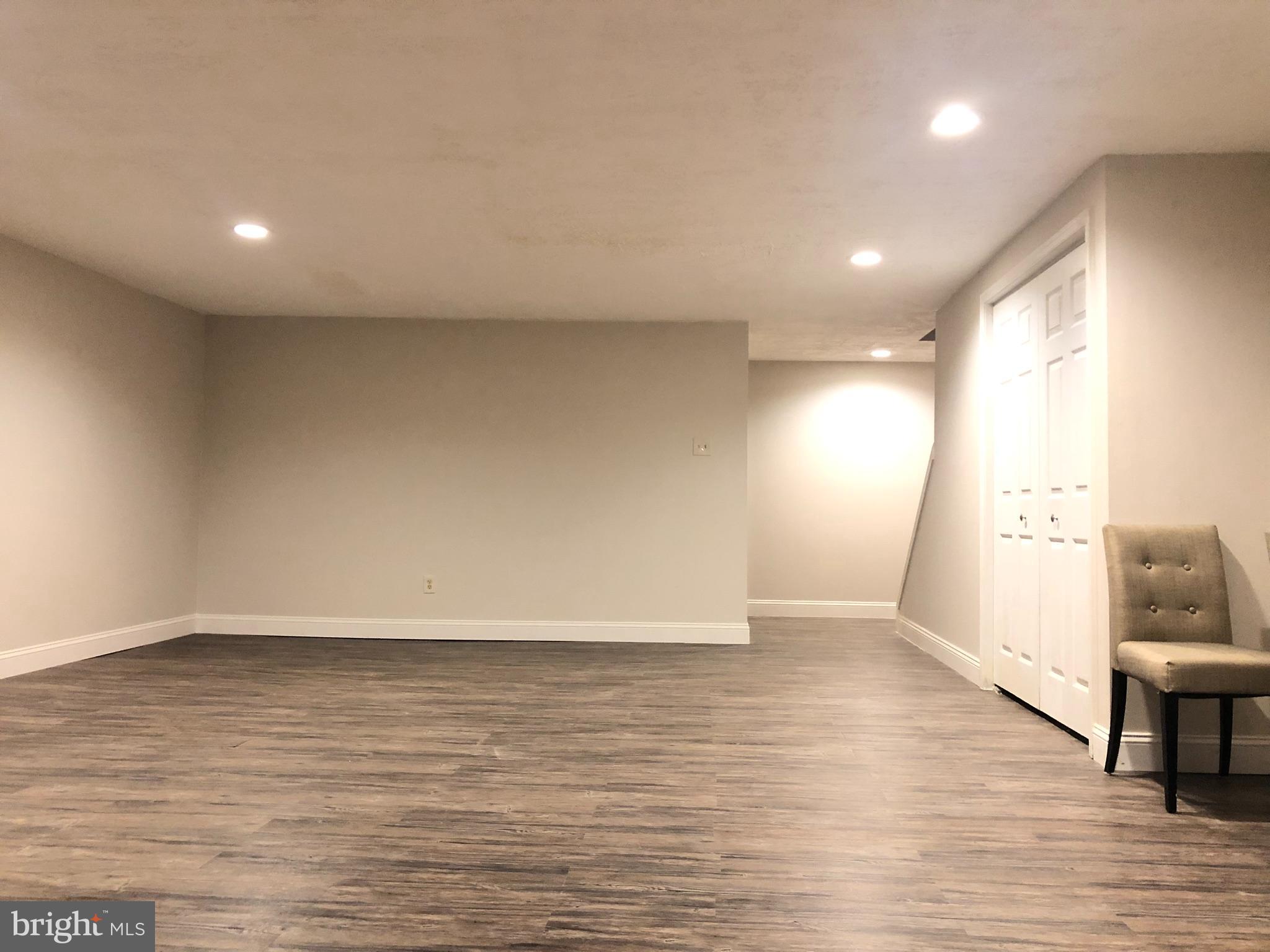 5 Algonquin Court Chesterbrook, PA 19087 - Photo 18 of 18 an empty room with wooden floor and furniture