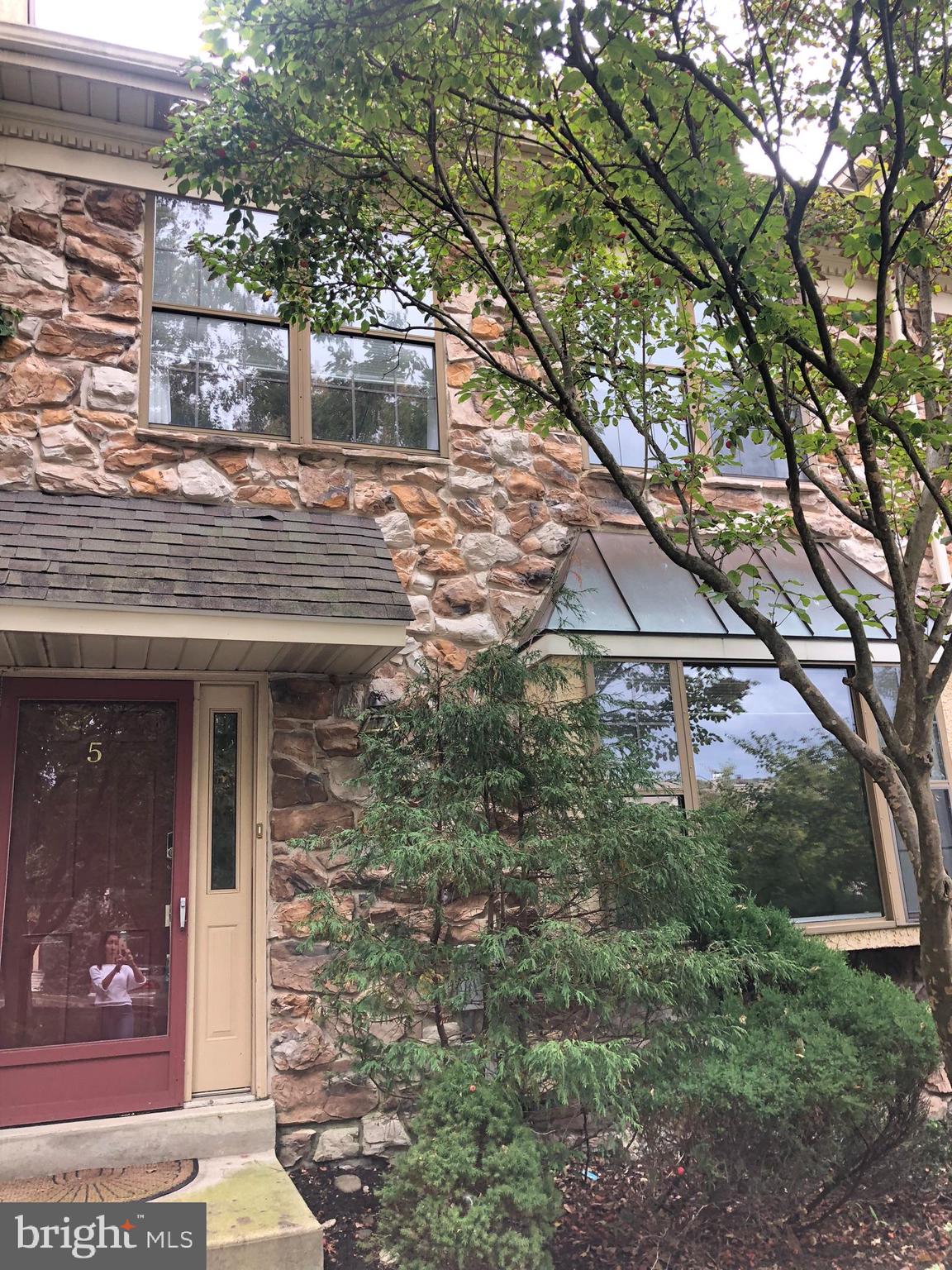 5 Algonquin Court Chesterbrook, PA 19087 - Photo 2 of 18 a front view of a house with a tree
