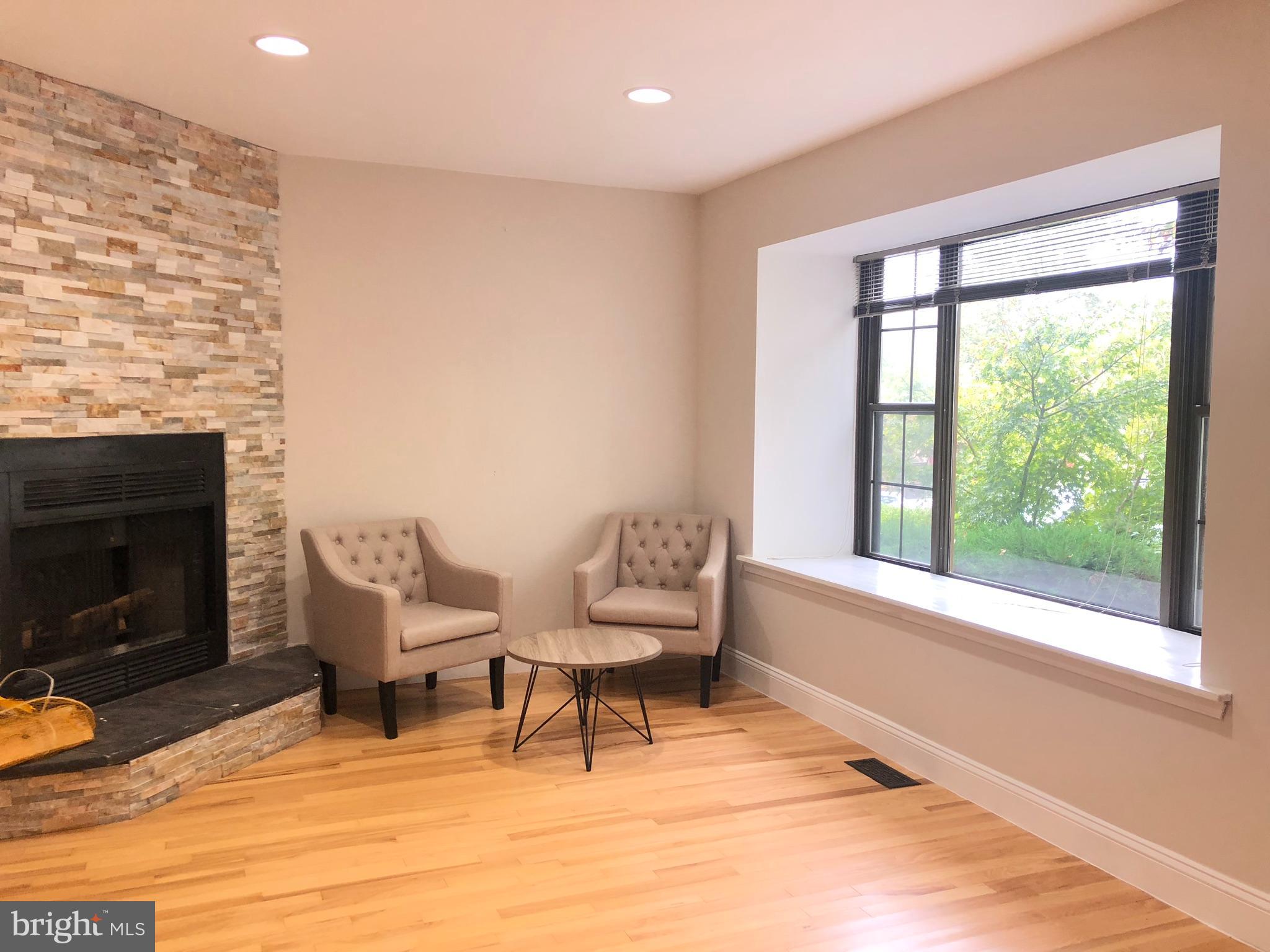 5 Algonquin Court Chesterbrook, PA 19087 - Photo 3 of 18 a living room with furniture and a fireplace