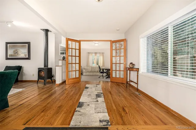 a bedroom with a bed couch and window