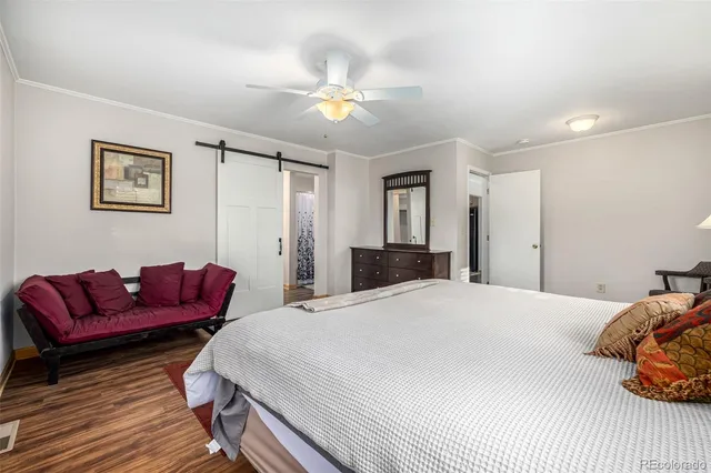 a bedroom with double bed and a window