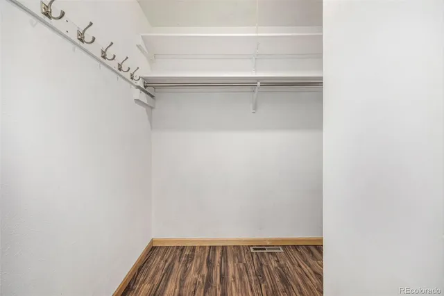 a view of house with backyard and swimming pool