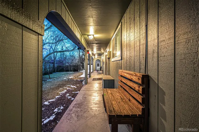 a living room with furniture a rug and a window
