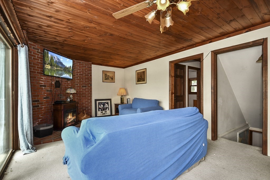 353 Rindge Turnpike Ashburnham, MA 01430 - Photo 7 of 38 a bedroom with a bed dresser and a large window