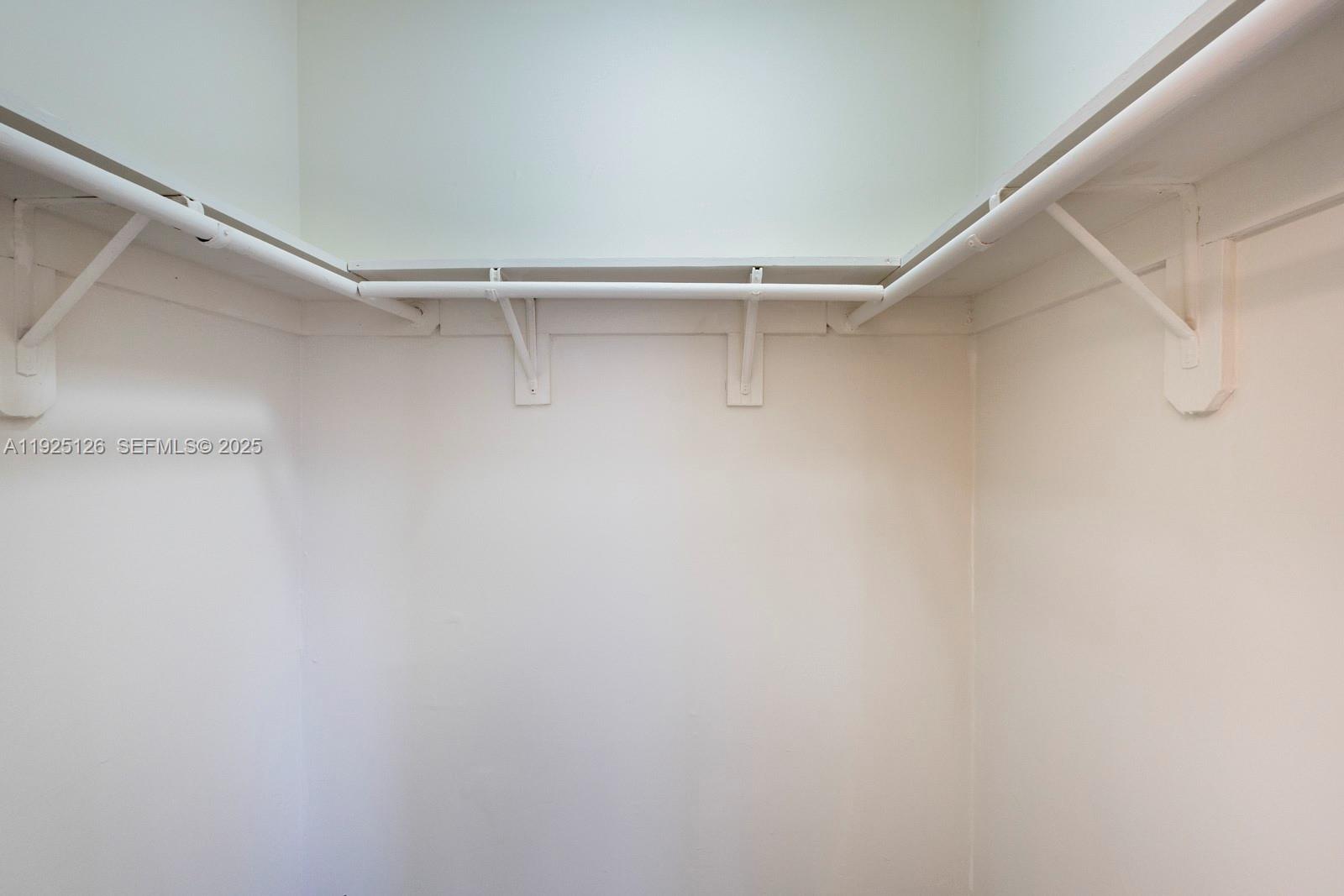 460 East 23rd Street, Unit 302 Hialeah, FL 33013 - Photo 11 of 15 a view of a room with shelf on the wall