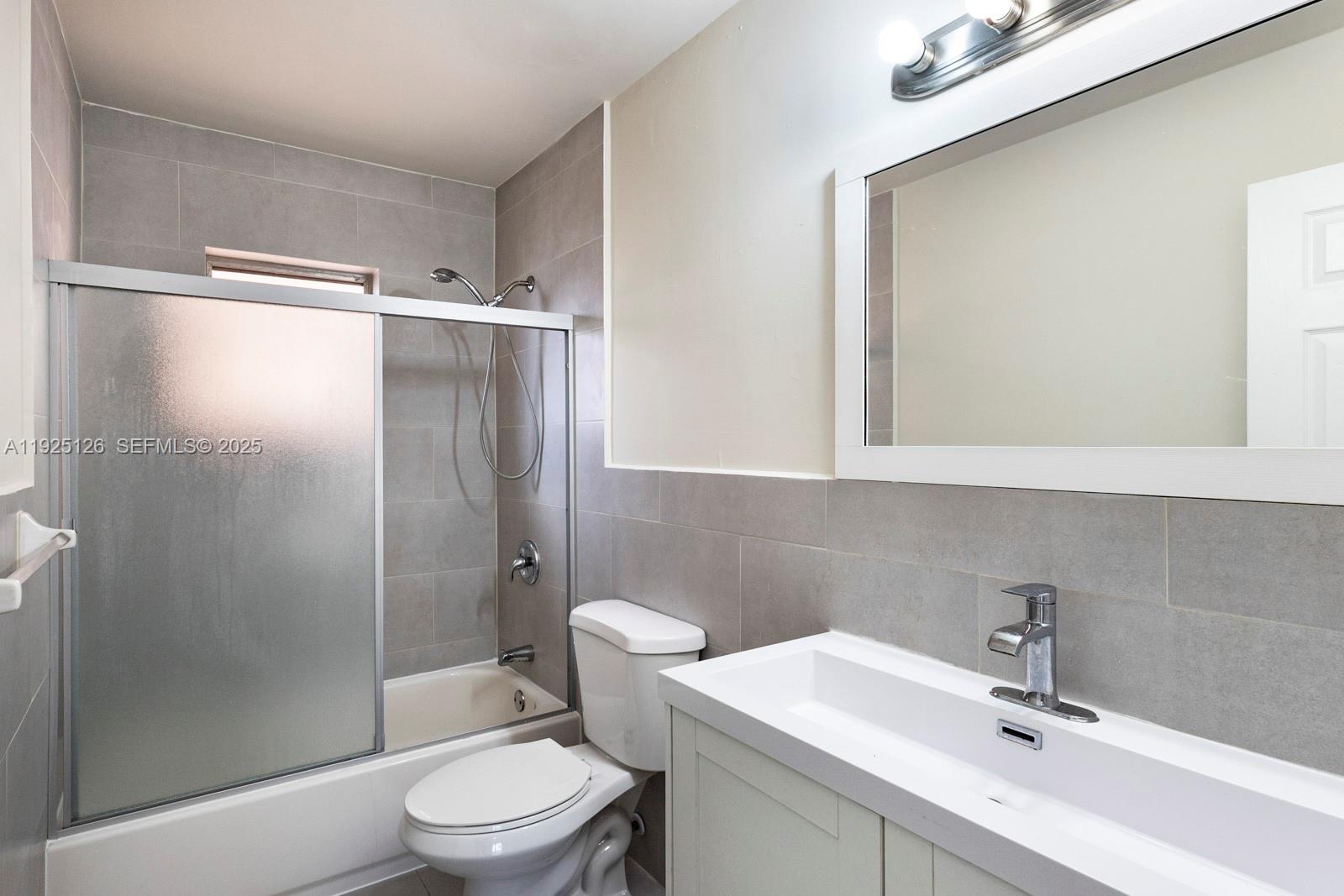 460 East 23rd Street, Unit 302 Hialeah, FL 33013 - Photo 13 of 15 a bathroom with a sink toilet and shower
