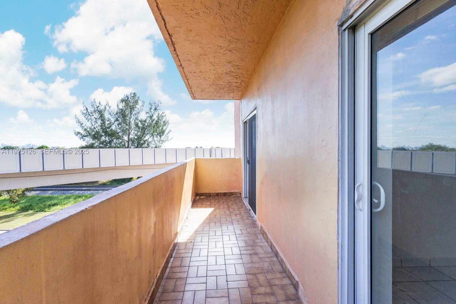 460 East 23rd Street, Unit 302 Hialeah, FL 33013 - Photo 14 of 15 a view of balcony with outdoor