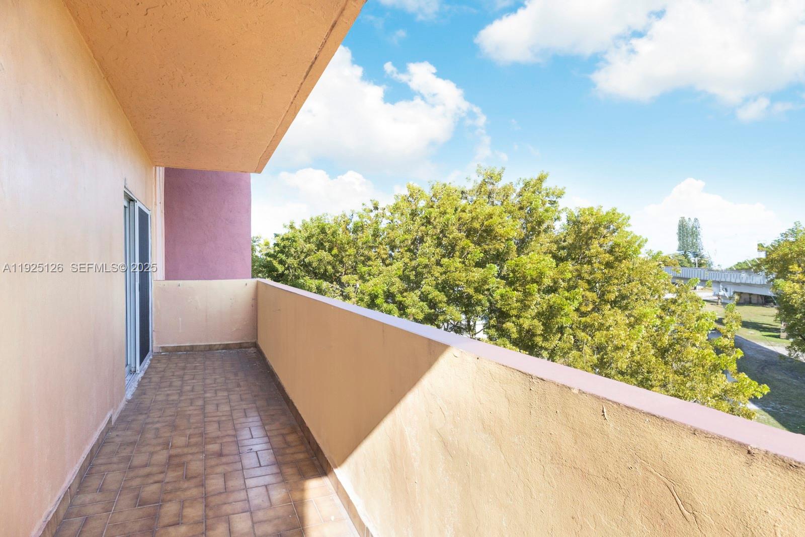 460 East 23rd Street, Unit 302 Hialeah, FL 33013 - Photo 15 of 15 a view of a balcony with an outdoor space