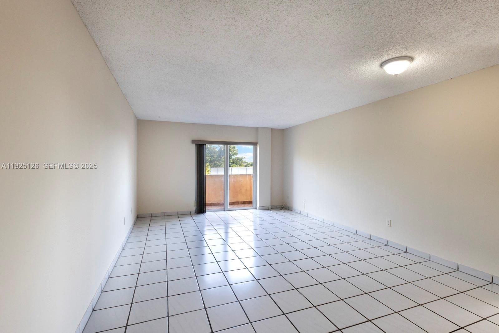 460 East 23rd Street, Unit 302 Hialeah, FL 33013 - Photo 4 of 15 a view of an empty room and window