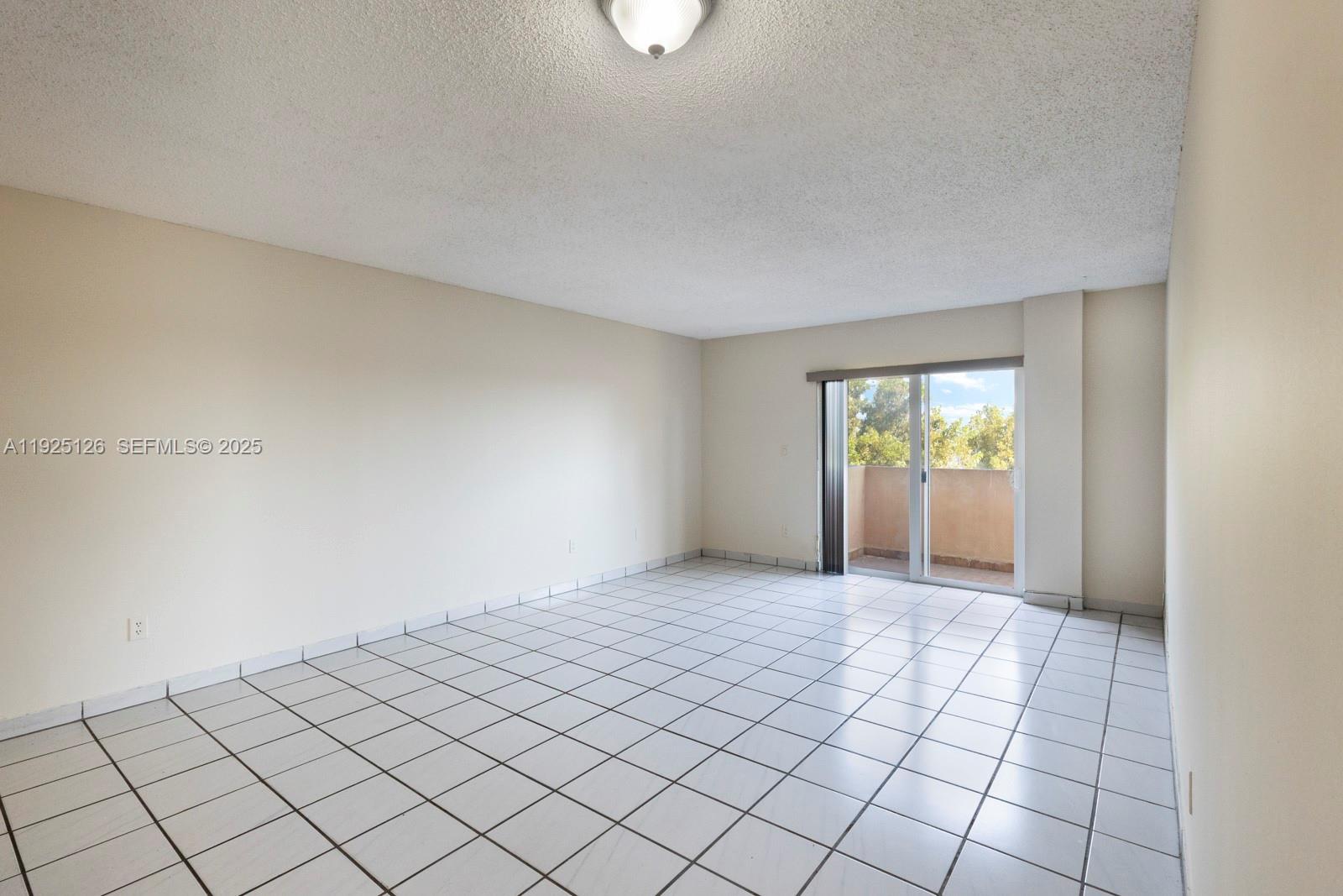 460 East 23rd Street, Unit 302 Hialeah, FL 33013 - Photo 5 of 15 a view of an empty room and window