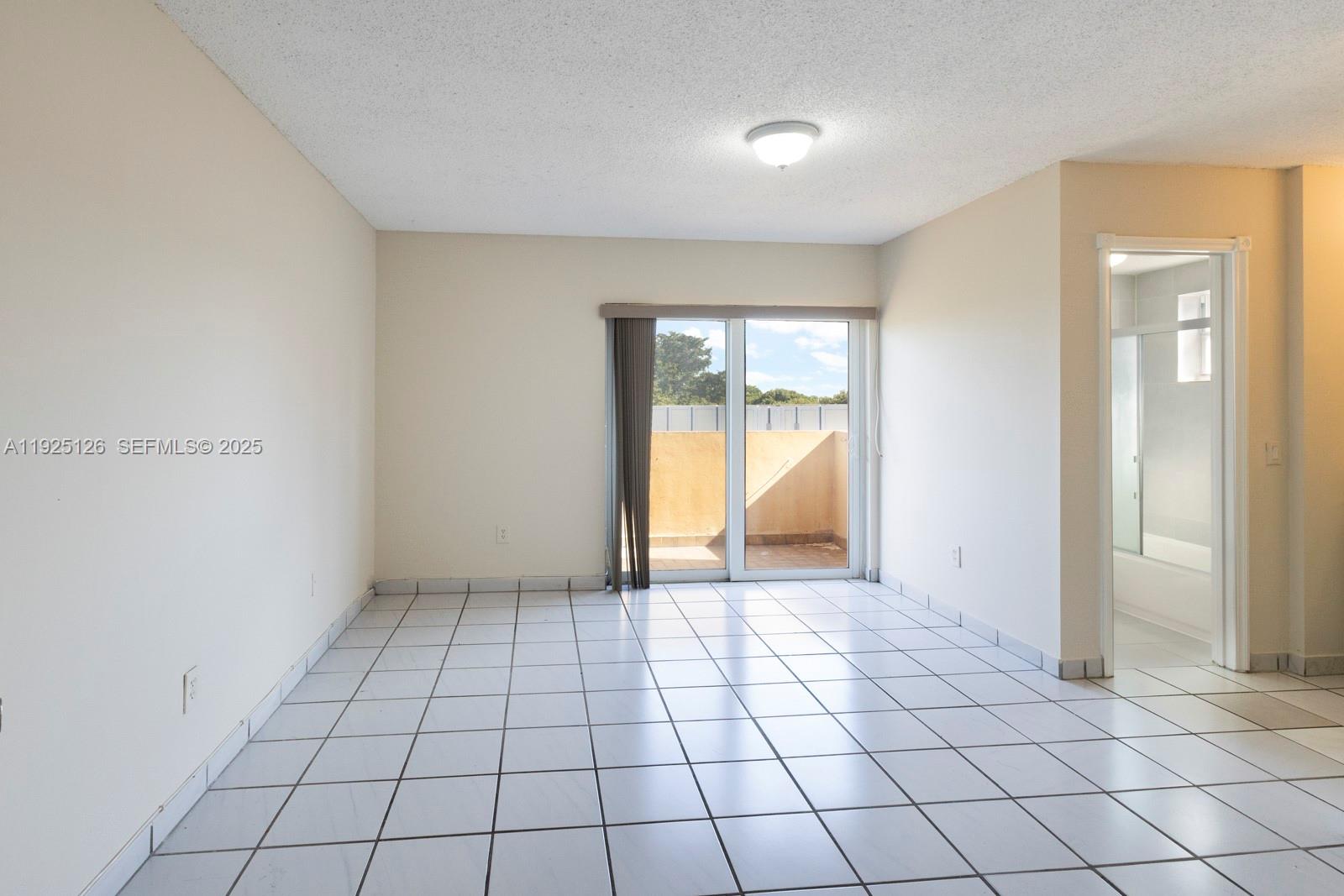 460 East 23rd Street, Unit 302 Hialeah, FL 33013 - Photo 8 of 15 a view of an empty room and window