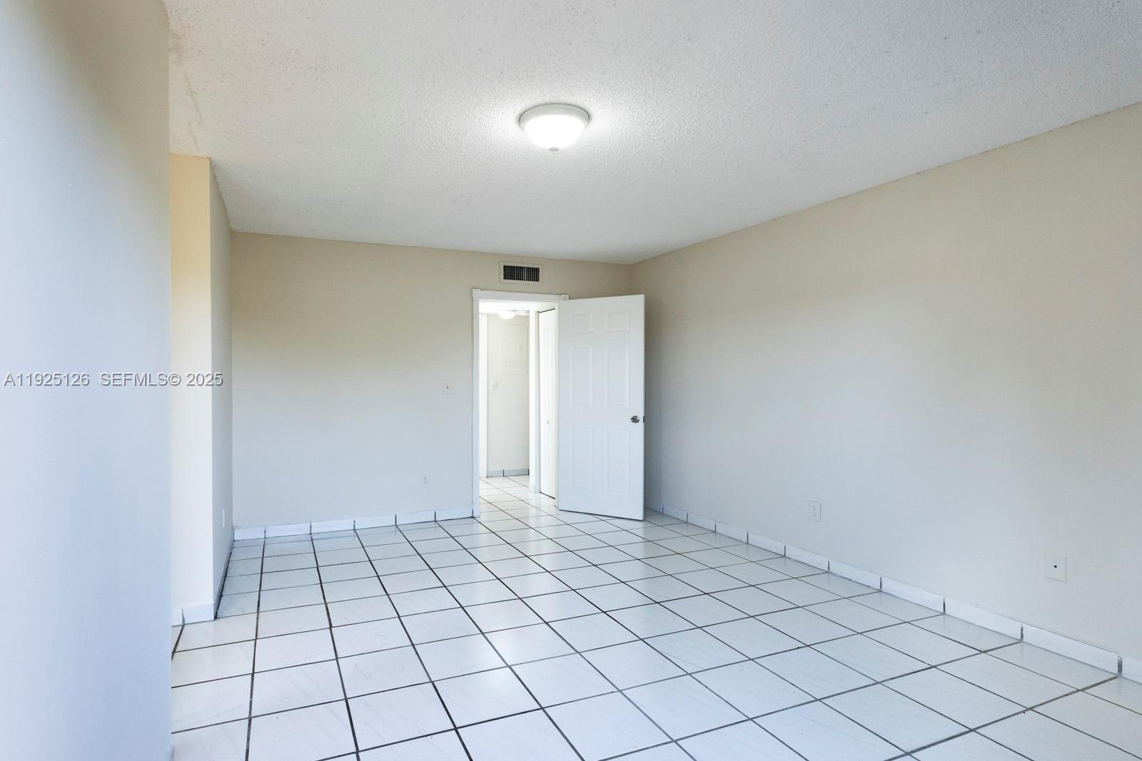460 East 23rd Street, Unit 302 Hialeah, FL 33013 - Photo 9 of 15 a view of an empty room