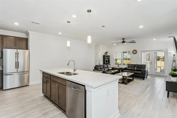 a bedroom with a bed and a tv on the wall