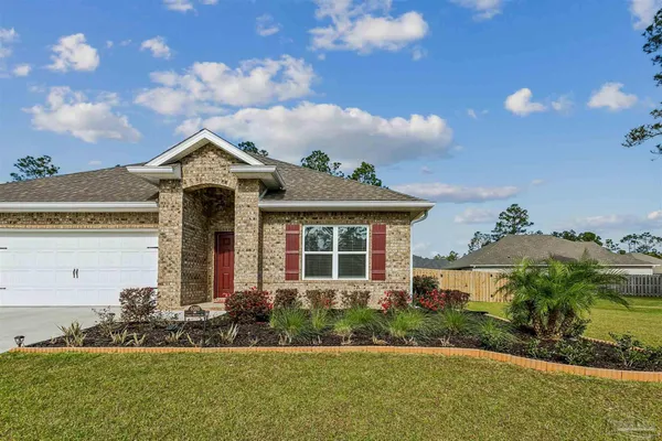 front view of a house with a yard