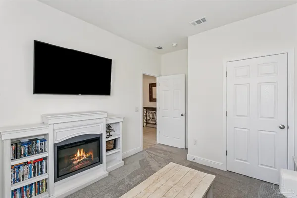 a view of a workspace with furniture and wooden floor