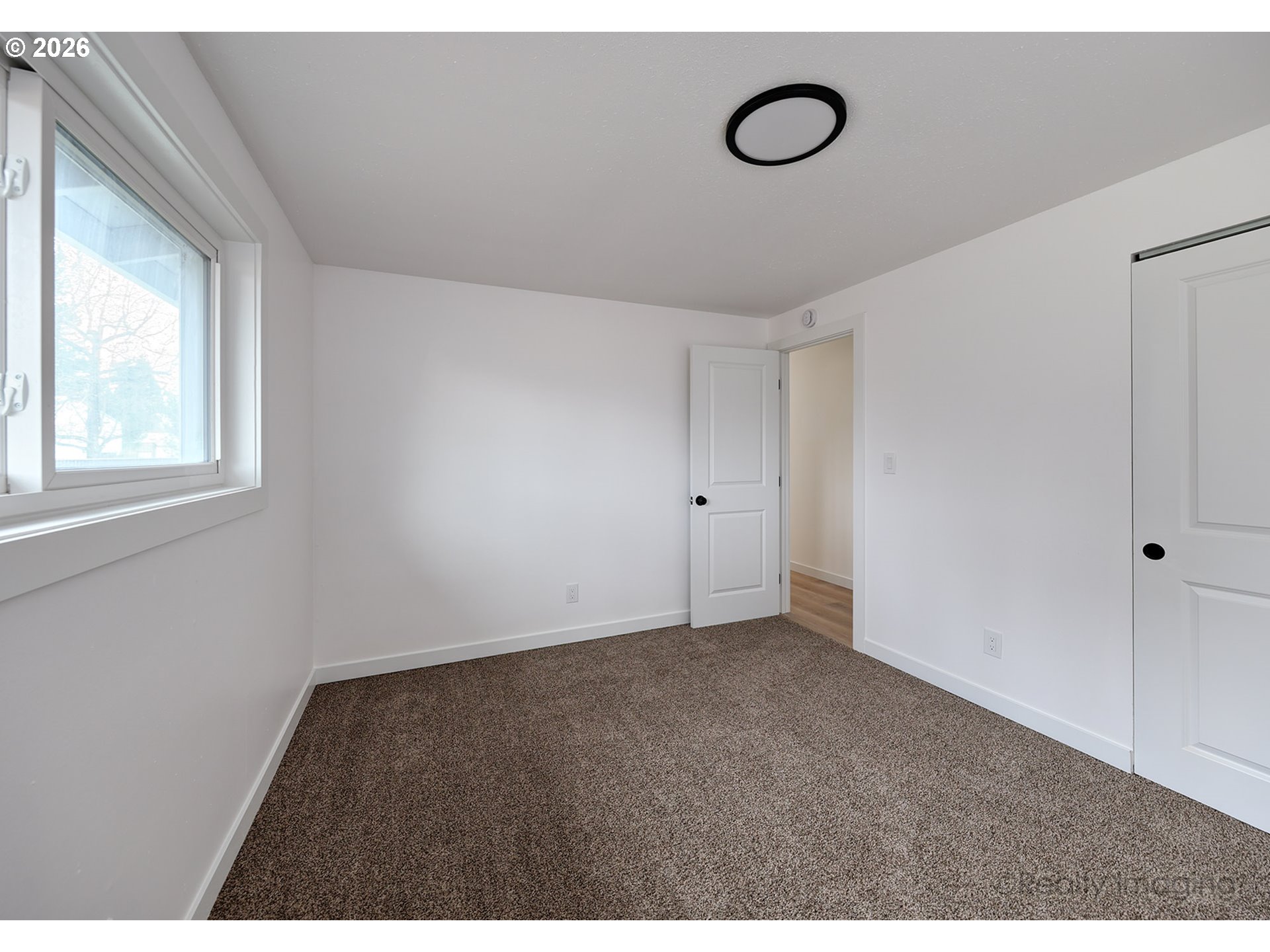 3075 Northeast Lancaster Street Corvallis, OR 97330 - Photo 11 of 13 a view of an empty room with a window