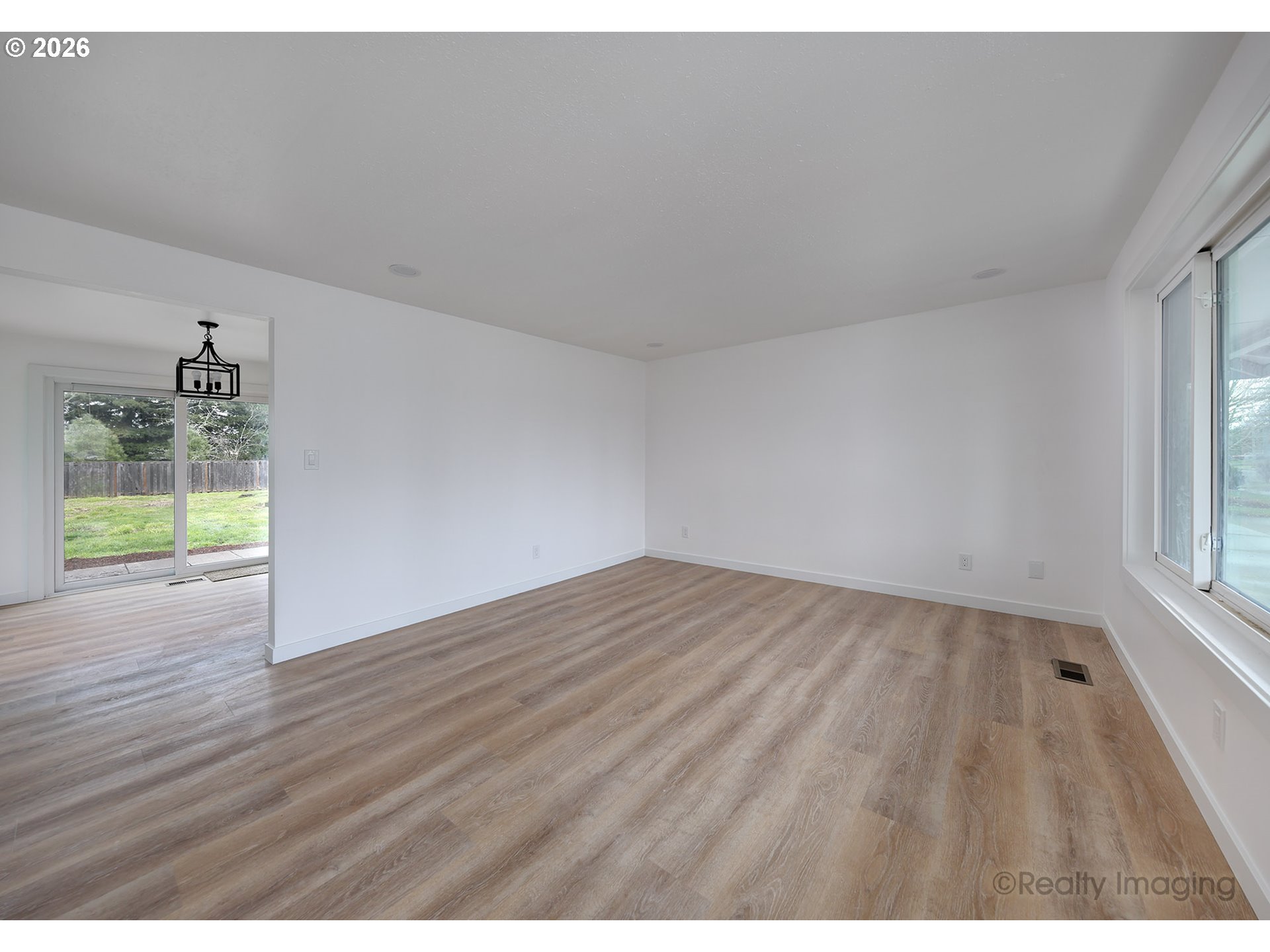 3075 Northeast Lancaster Street Corvallis, OR 97330 - Photo 4 of 13 a view of empty room with wooden floor and fan
