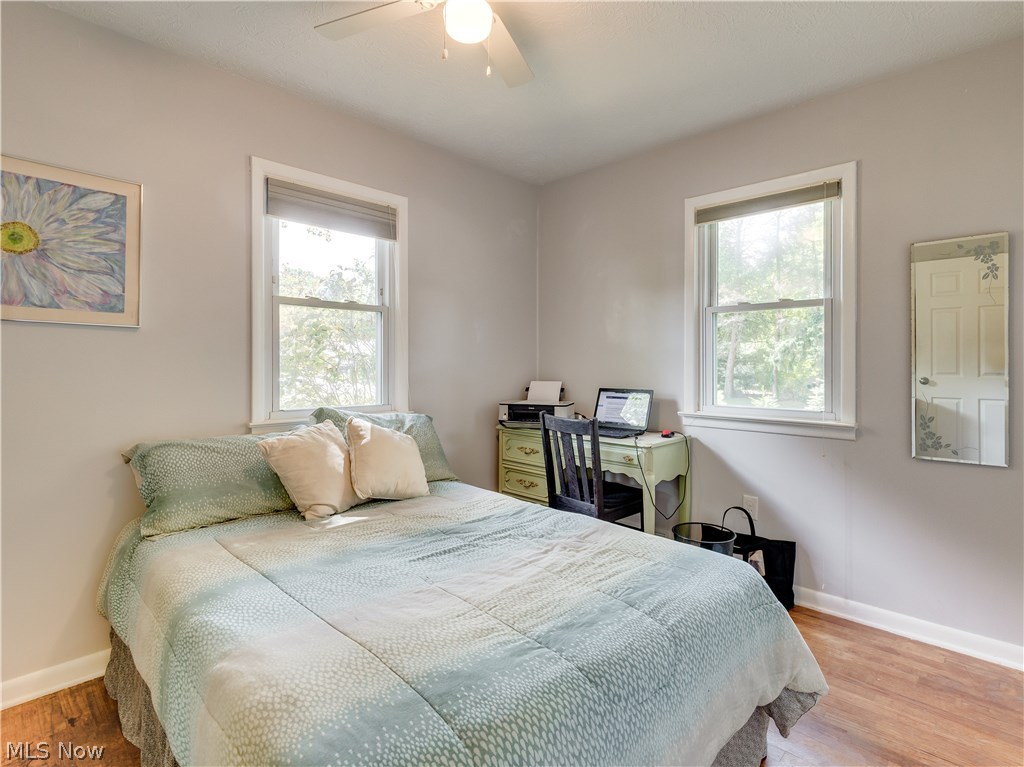 2983 Littledale Road Akron, OH 44319 - Photo 21 of 27 This bedroom, which is 1 of 3, features beautiful hard wood floors, ceiling fan and closet space.