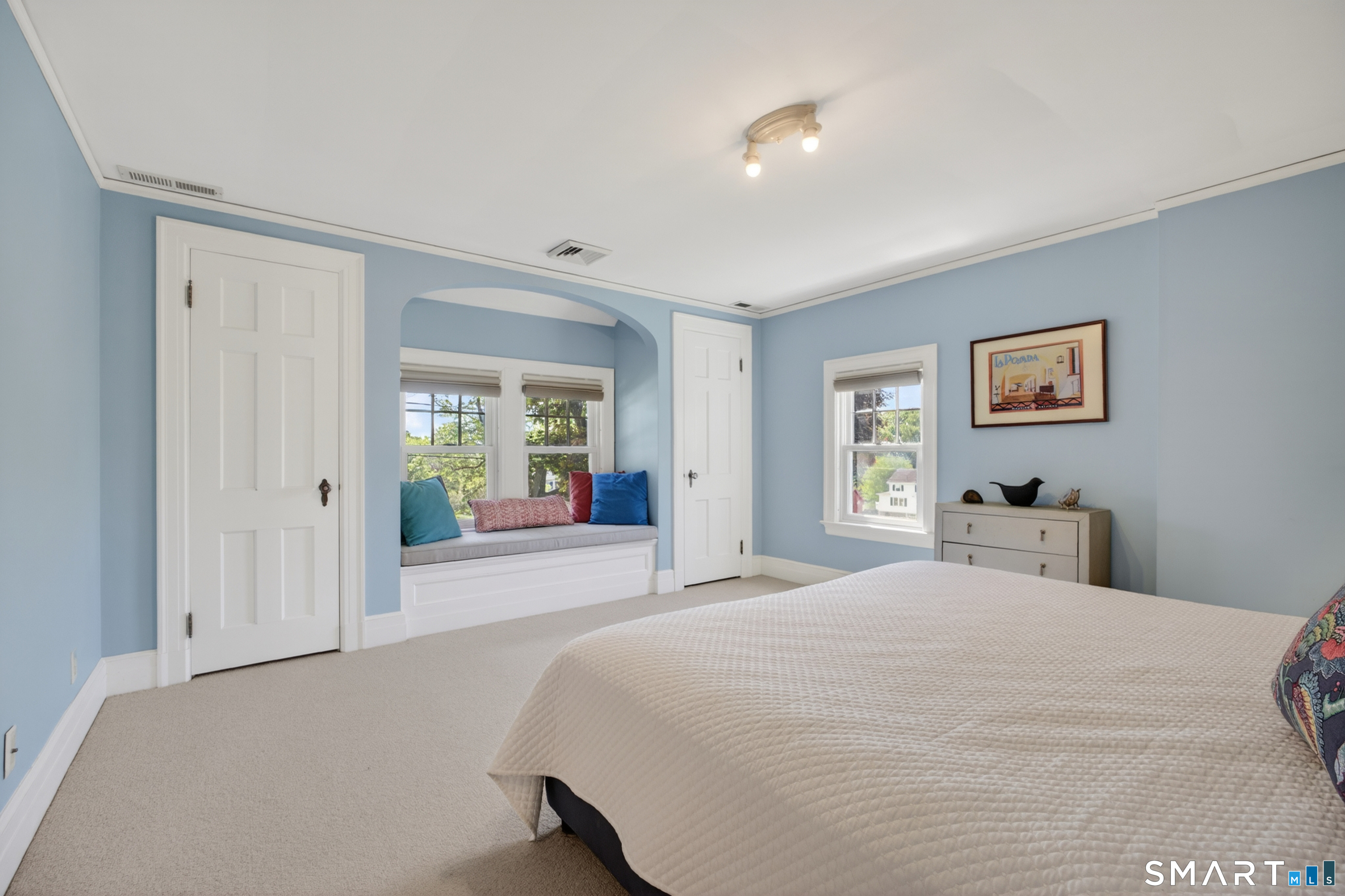 10 Prospect Street Groton, CT 06355 - Photo 33 of 40 a bedroom with a large bed and a chandelier