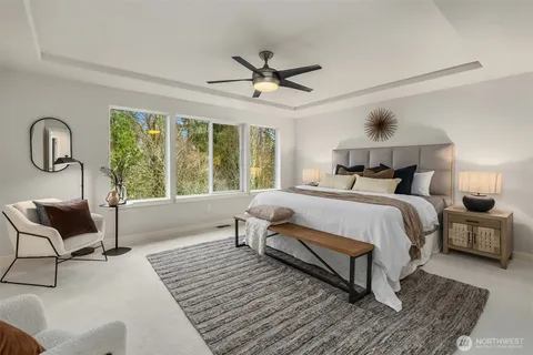 a bed room with a bed and a chair