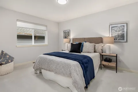 a bedroom with bed and window