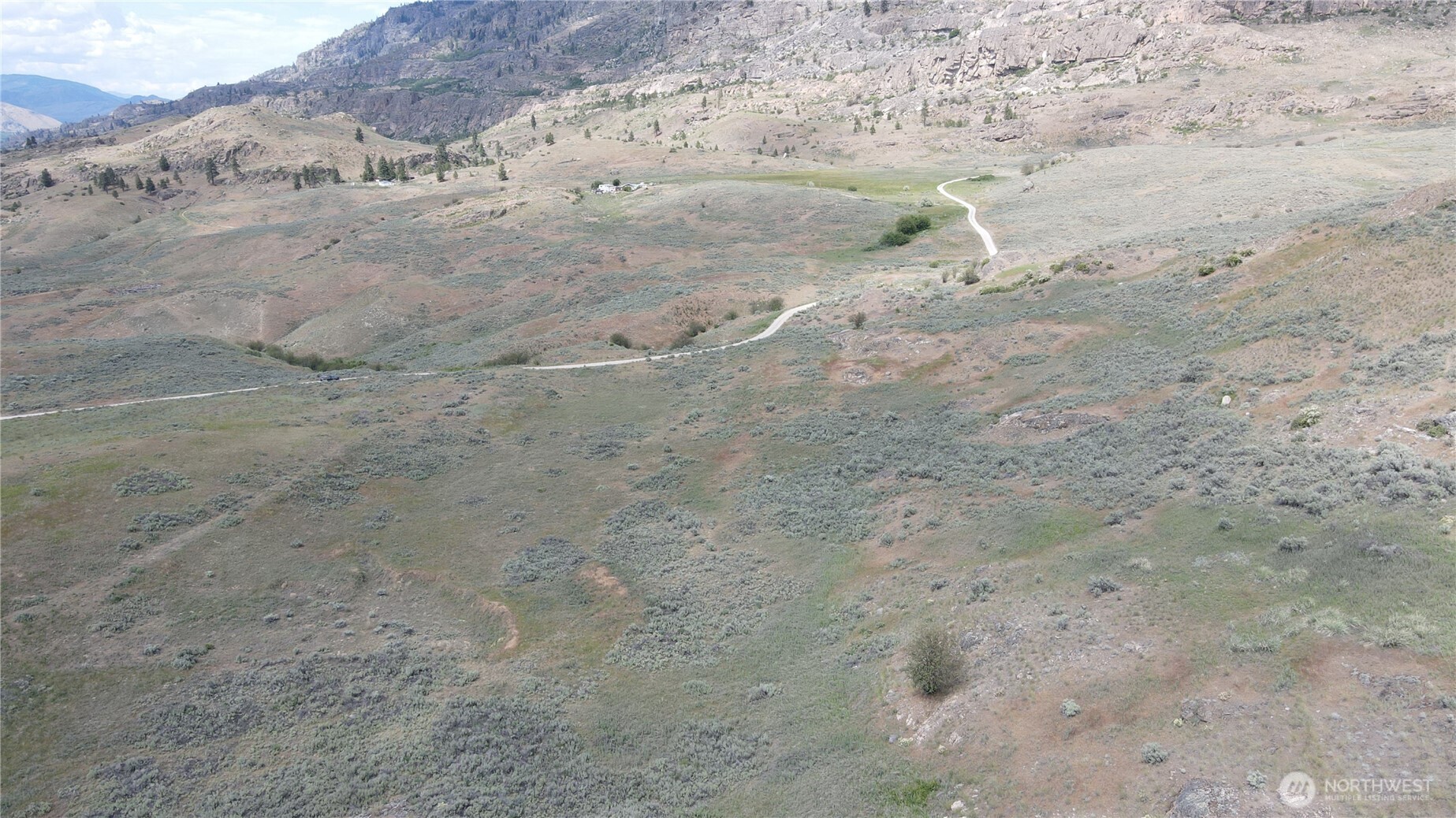 -lot B Swanson Mill Road Oroville, WA 98844 - Photo 4 of 13 a view of dirt field with mountain in the background