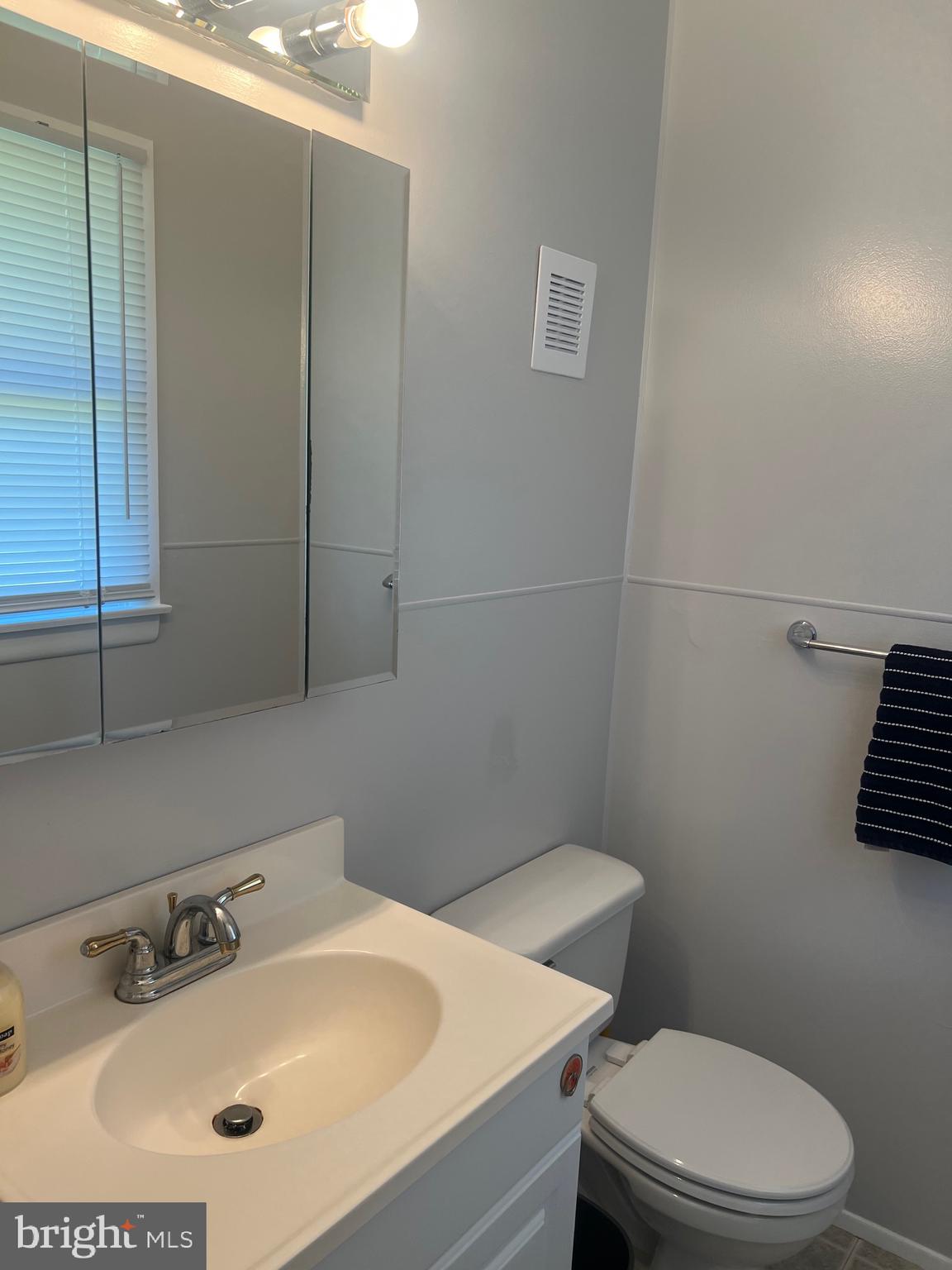 705 Bayberry Road Edgewood, MD 21040 - Photo 16 of 28 a bathroom with a sink a toilet and mirror