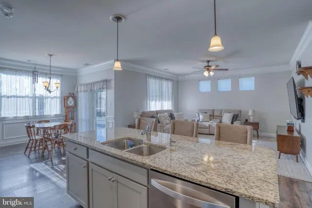 a kitchen with counter top space a sink and appliances