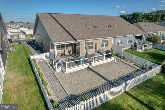 an aerial view of a house with deck and patio