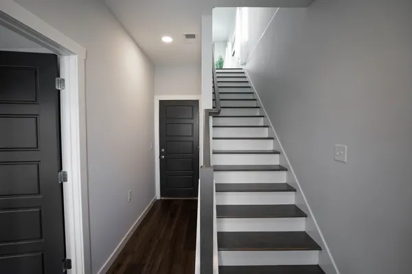 a view of entryway with wooden floor
