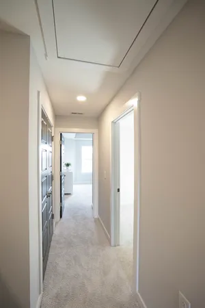 a view of hallway with wooden floor