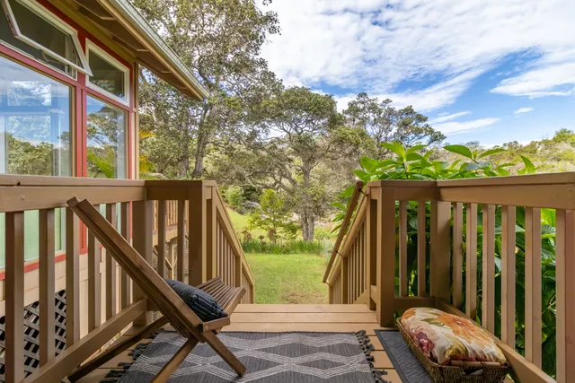 a bed room with a bed and a chair