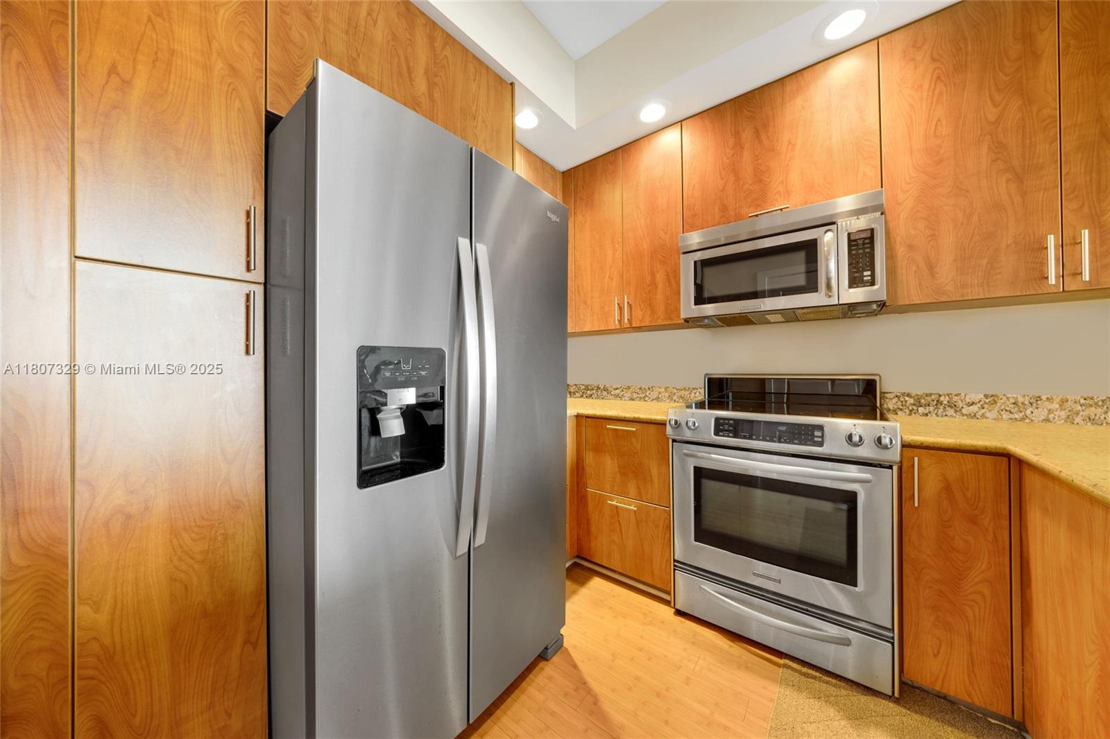 315 Northeast 3rd Avenue, Unit 1809 Fort Lauderdale, FL 33301 - Photo 15 of 32 a kitchen with stainless steel appliances a refrigerator stove and microwave