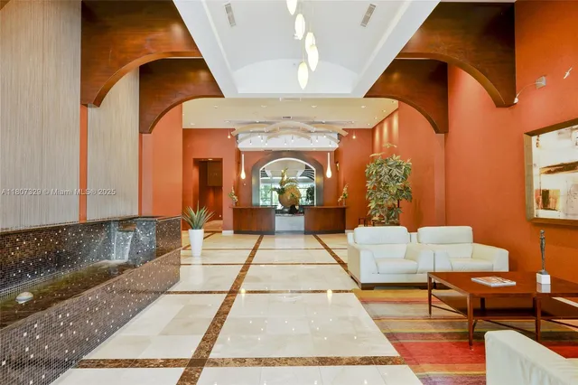 a view of living room with furniture and a rug