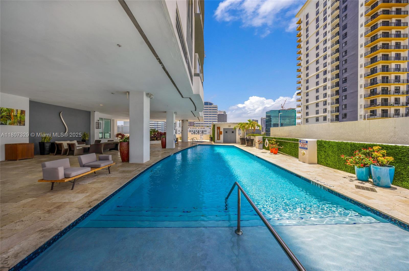 315 Northeast 3rd Avenue, Unit 1809 Fort Lauderdale, FL 33301 - Photo 27 of 32 a view of swimming pool with outdoor seating
