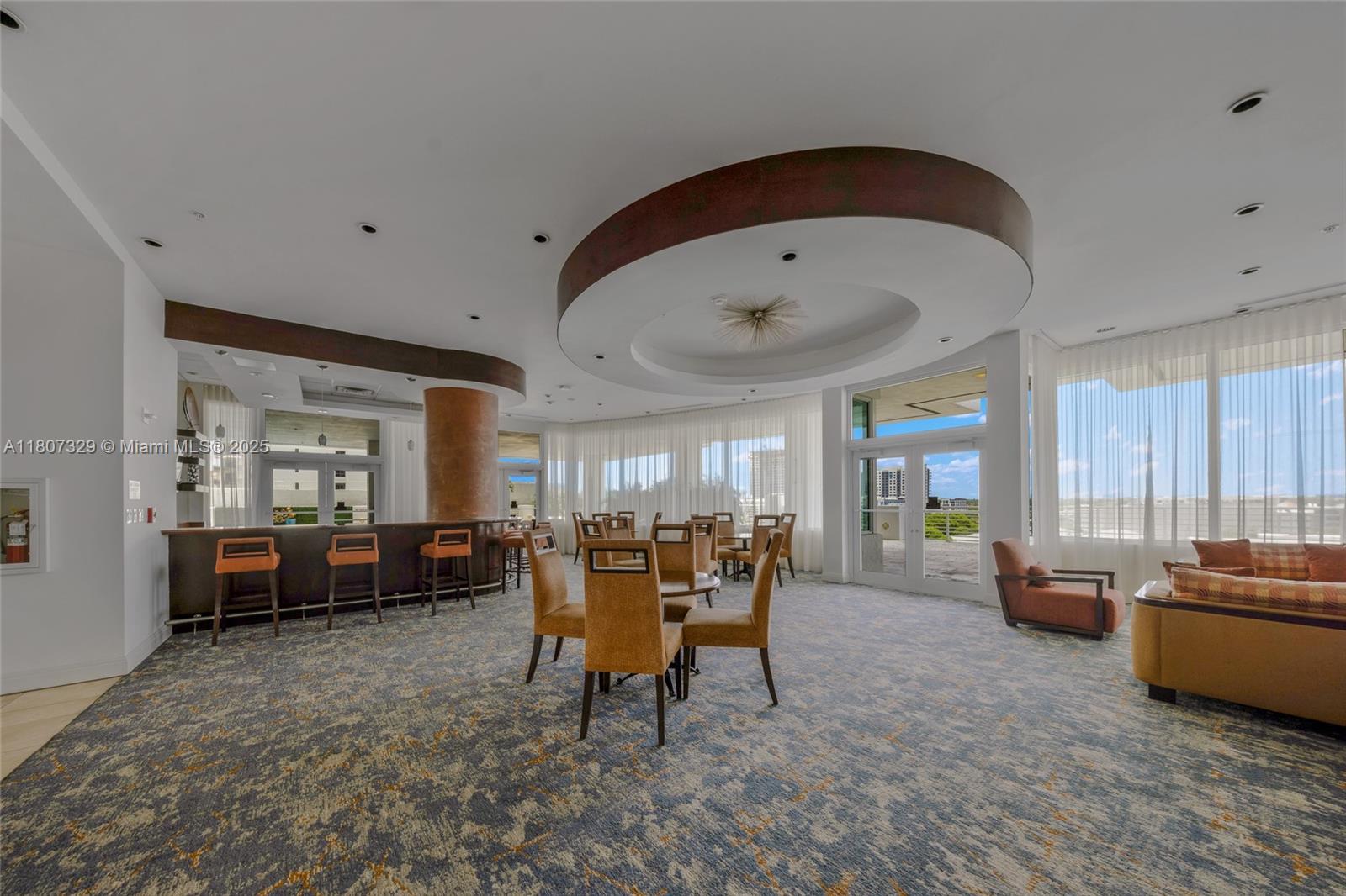 315 Northeast 3rd Avenue, Unit 1809 Fort Lauderdale, FL 33301 - Photo 32 of 32 a living room with furniture and kitchen view