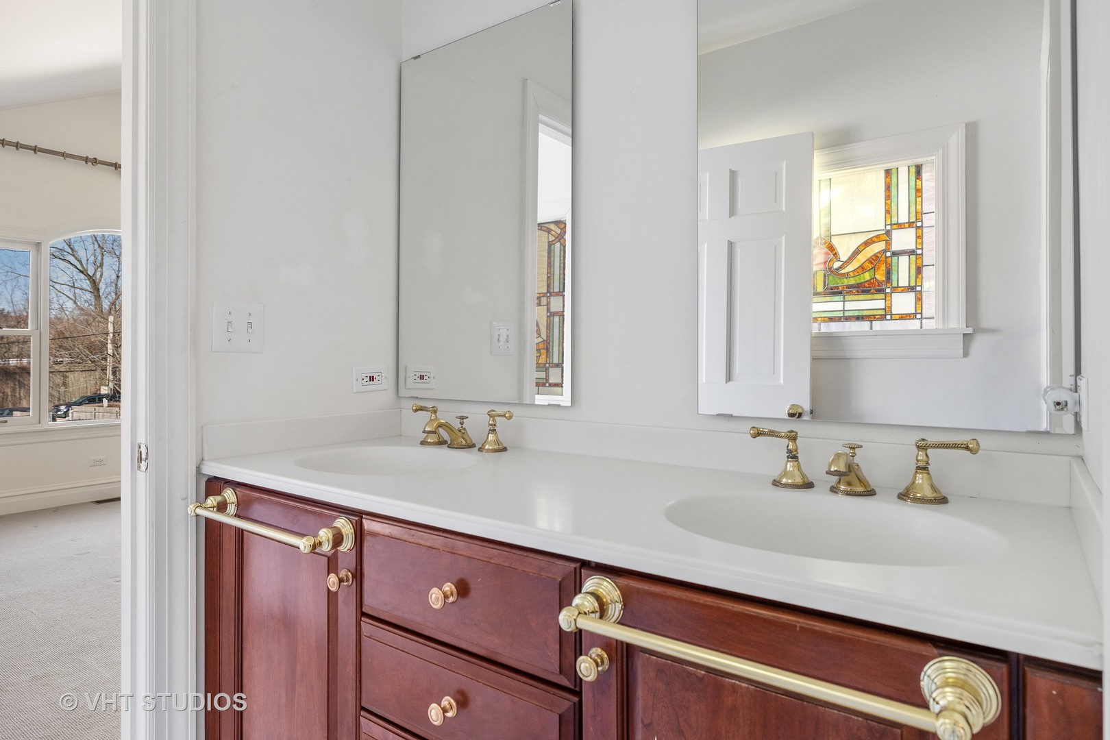 82 Warwick Road Winnetka, IL 60093 - Photo 14 of 23 a bathroom with a sink and a mirror