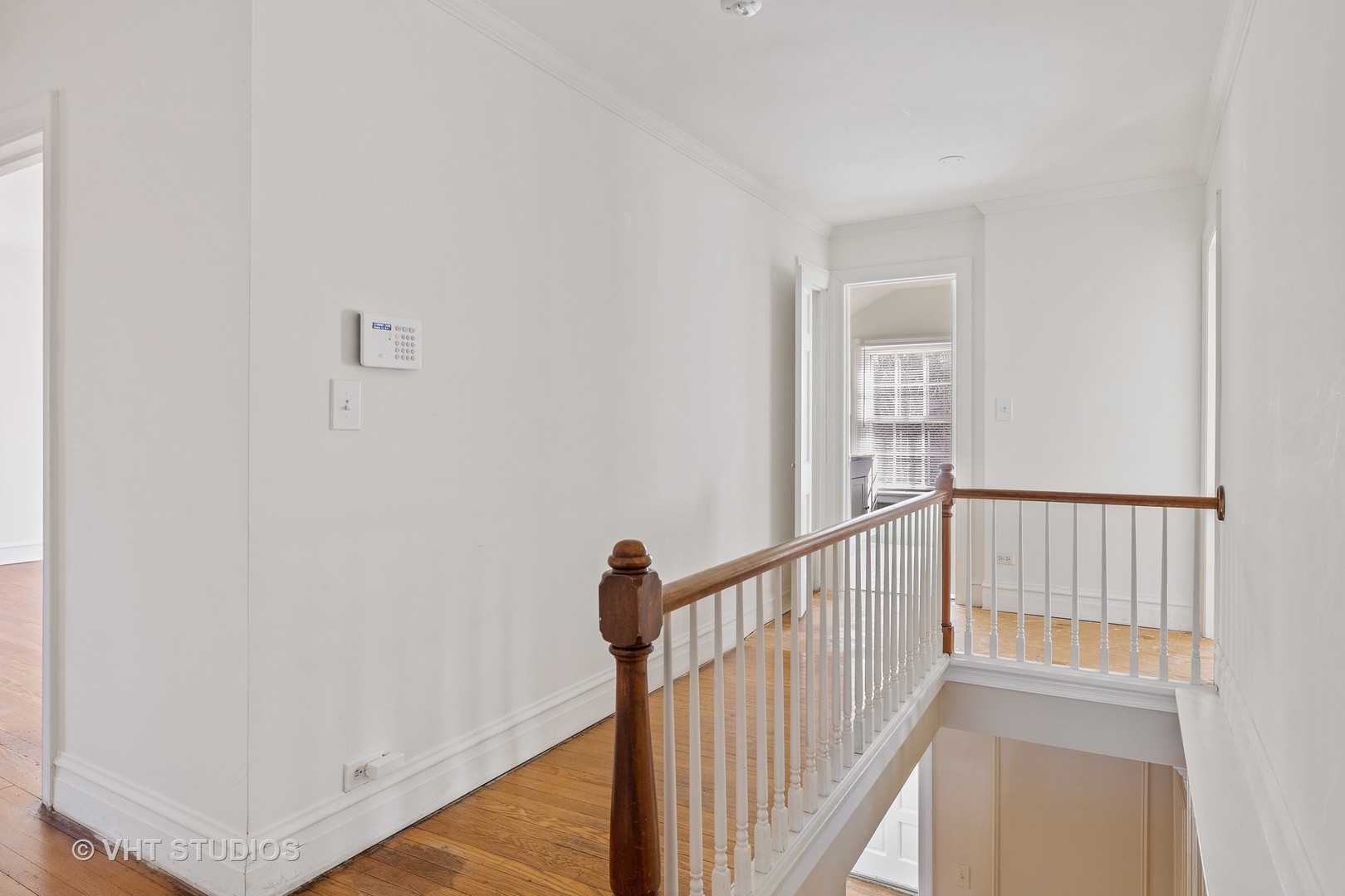 82 Warwick Road Winnetka, IL 60093 - Photo 16 of 23 a view of a hallway with wooden floor and entryway