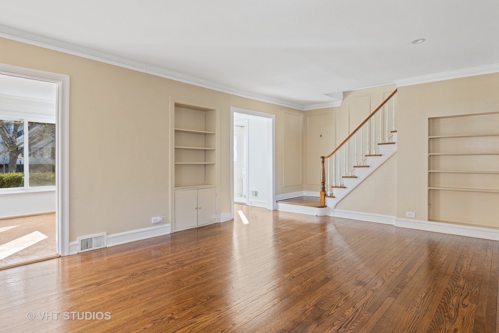 82 Warwick Road Winnetka, IL 60093 - Photo 3 of 23 a view of an empty room with wooden floor and stairs