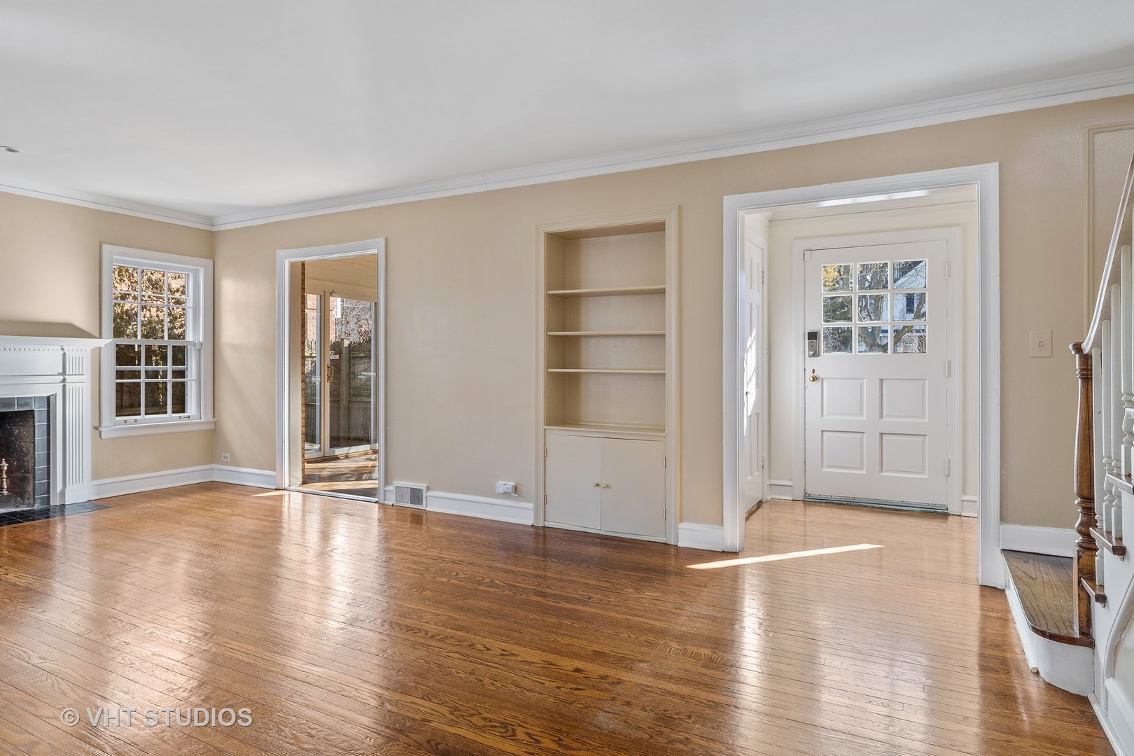 82 Warwick Road Winnetka, IL 60093 - Photo 5 of 23 a view of an empty room with wooden floor and a window