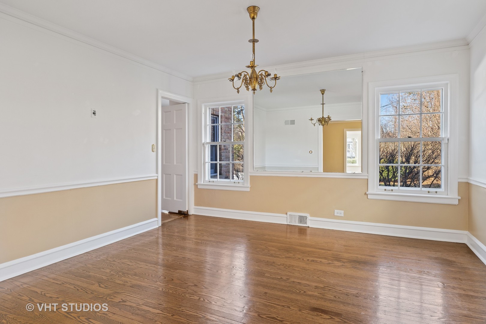 82 Warwick Road Winnetka, IL 60093 - Photo 6 of 23 an empty room with wooden floor and windows