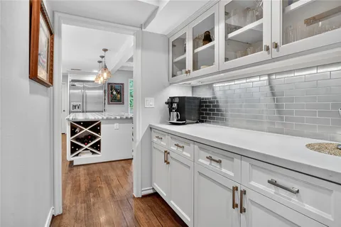 a kitchen with stainless steel appliances granite countertop a stove and a refrigerator