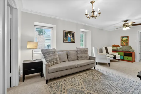 a spacious bedroom with a bed and window