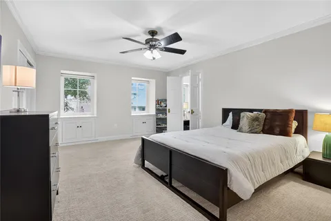 a bedroom with furniture and a flat tv screen
